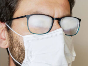 man with specs and face mask