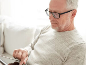 aged man using tablet mobile